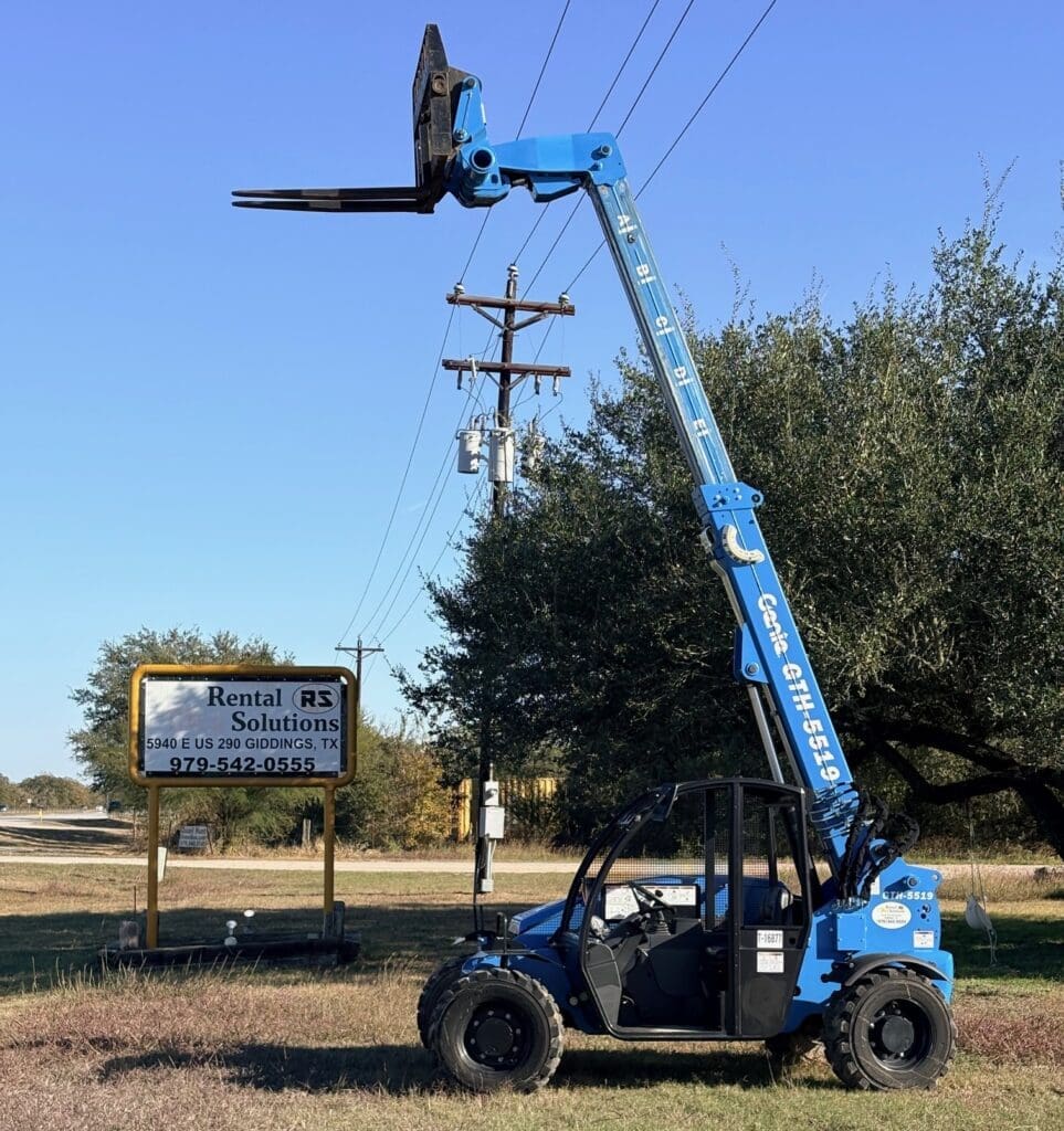 A blue Genie GTH-5519 telehandler with its boom